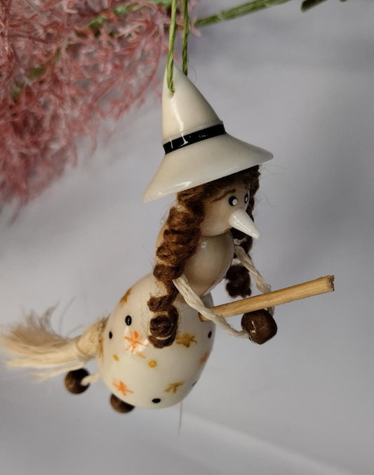 Little witch in tagua. Handmade. Object to decorate.