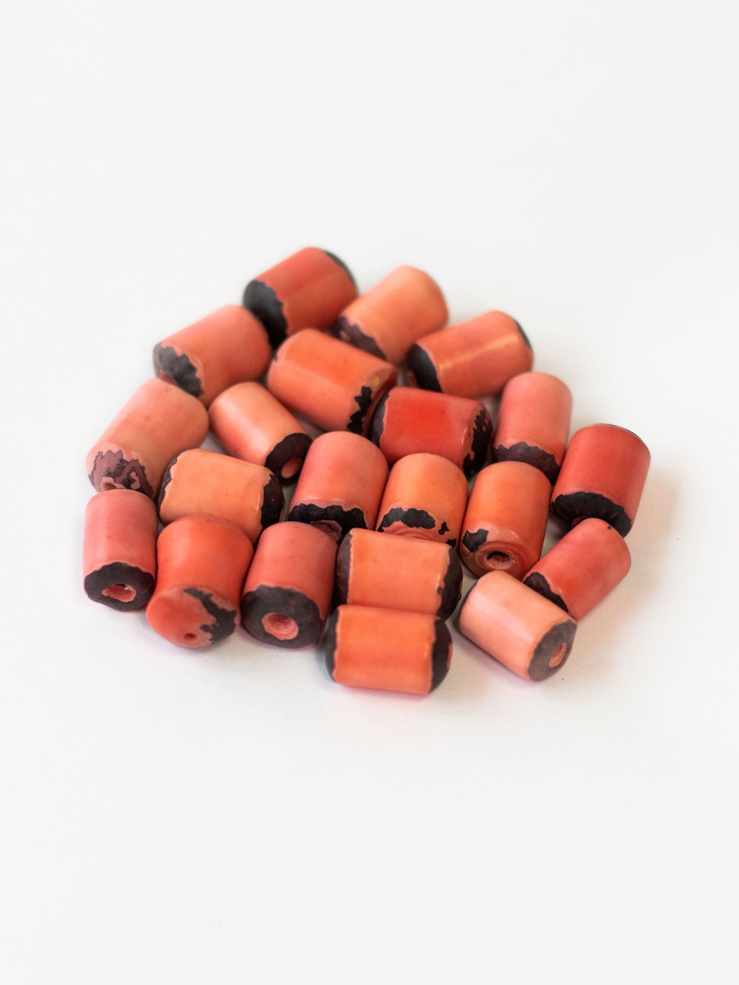 Tagua Irregular Cylinder Beads. 15 Salmon Pieces