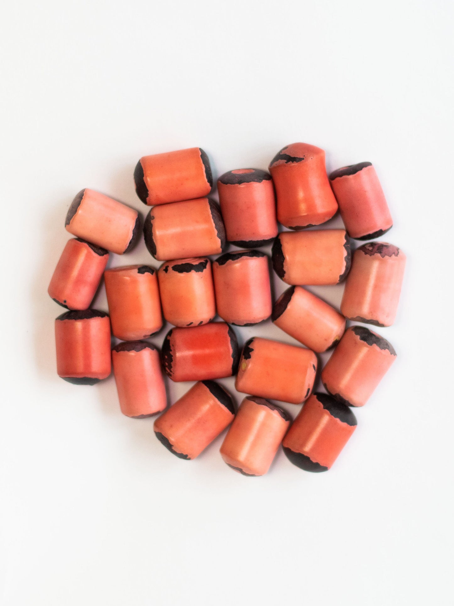 Tagua Irregular Cylinder Beads. 15 Salmon Pieces