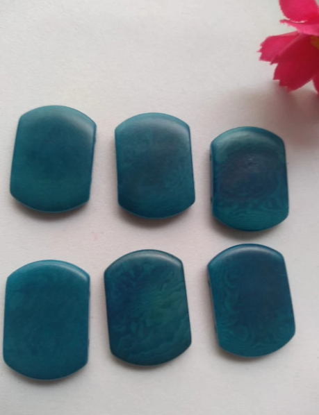 Tagua nut beads. Tagua curved rectangle shape. 15 pieces of tagua in blue. Vertical top drilled 2 holes. 2.5x1.5cm. approx. Ethical Jewelry