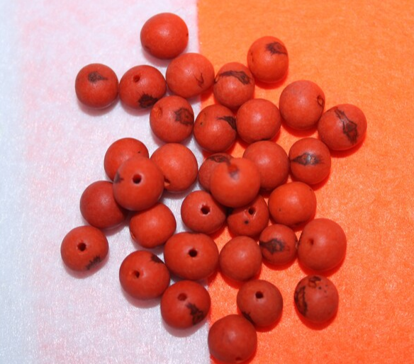 Orange beads Acai seeds from the Colombian Amazonian palm. Size: 1x1cm. Hole size 1mm approx. natural accounts. Pack of 200 beads.
