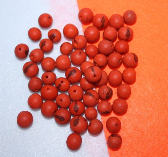 Orange beads Acai seeds from the Colombian Amazonian palm. Size: 1x1cm. Hole size 1mm approx. natural accounts. Pack of 200 beads.