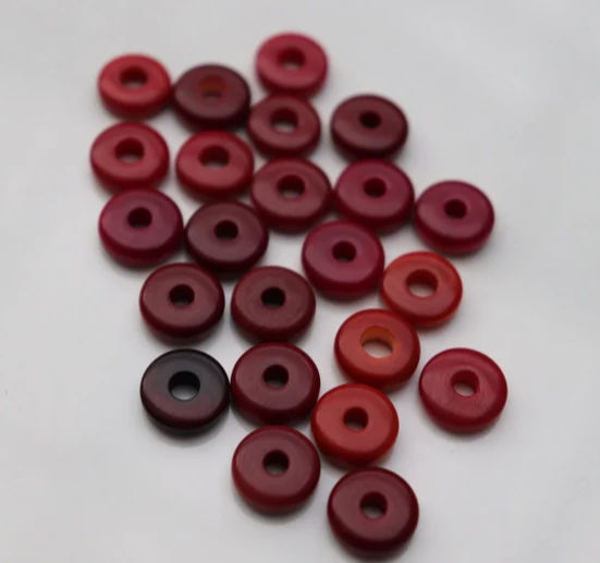 Tagua beads. 20 round mini beads of tagua discs in red. Center drilled. Size: 1cm. approx. Natural Jewelry Making Supplies from Colombia