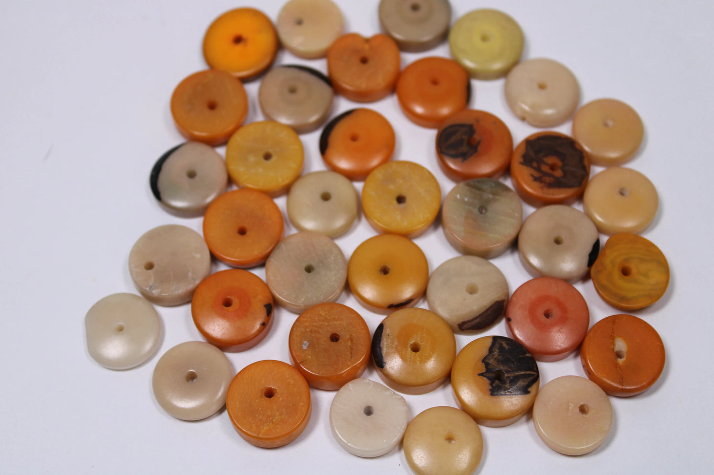 Tagua Donut Beads. 36 Mini Orange and Beige Pieces.