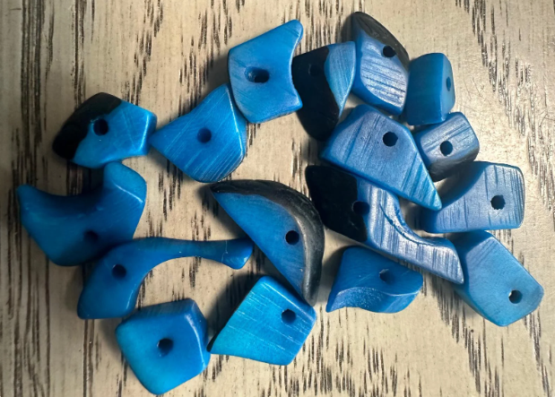 Mini tagua nuts, 100 pieces on blue beads. Size: approximately 1-2 cm. Center hole. Ideal for eco-friendly jewelry making. TBTBlue02