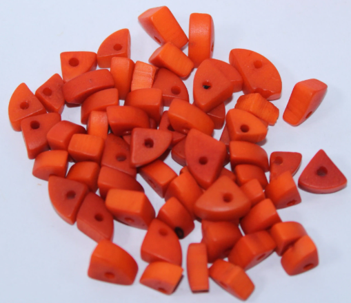 Mini tagua nuts in the shape of triangles. Orange color. 100 pieces. Approx 1cm x 0.7mm. Perforated in the center. Jewelry making TBTOrange01
