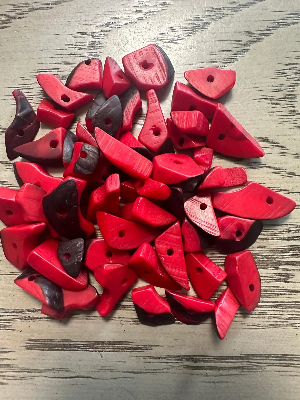 Mini tagua nuts, 100 pieces on Red beads. Size: approximately 1-2 cm. Center hole. Ideal for eco-friendly jewelry making. TBTRed01