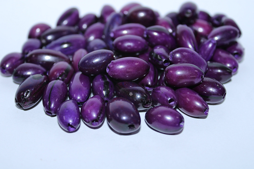 Dark Purple made of camajuro seeds from Colombia. Size: 2.5 x 1.5 cm. approx. Drilled. Natural Beads. Pack of 30 Beads. TCPurple03