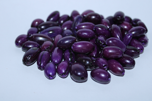 Dark Purple made of camajuro seeds from Colombia. Size: 2.5 x 1.5 cm. approx. Drilled. Natural Beads. Pack of 30 Beads. TCPurple03
