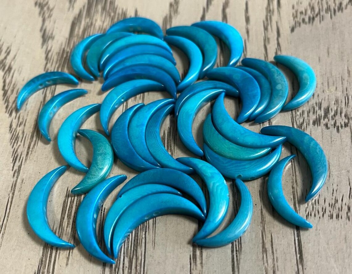 Tagua Crescent Moon Beads. 15 Blue Pieces