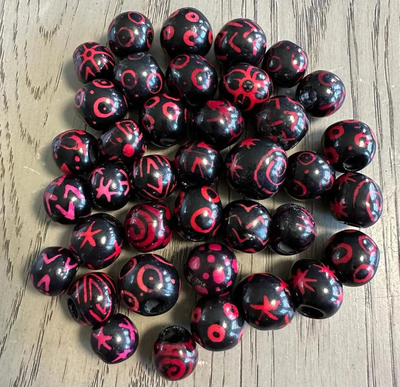 Bombona Ball Beads. 25 Black and Pink Patterned Pieces.