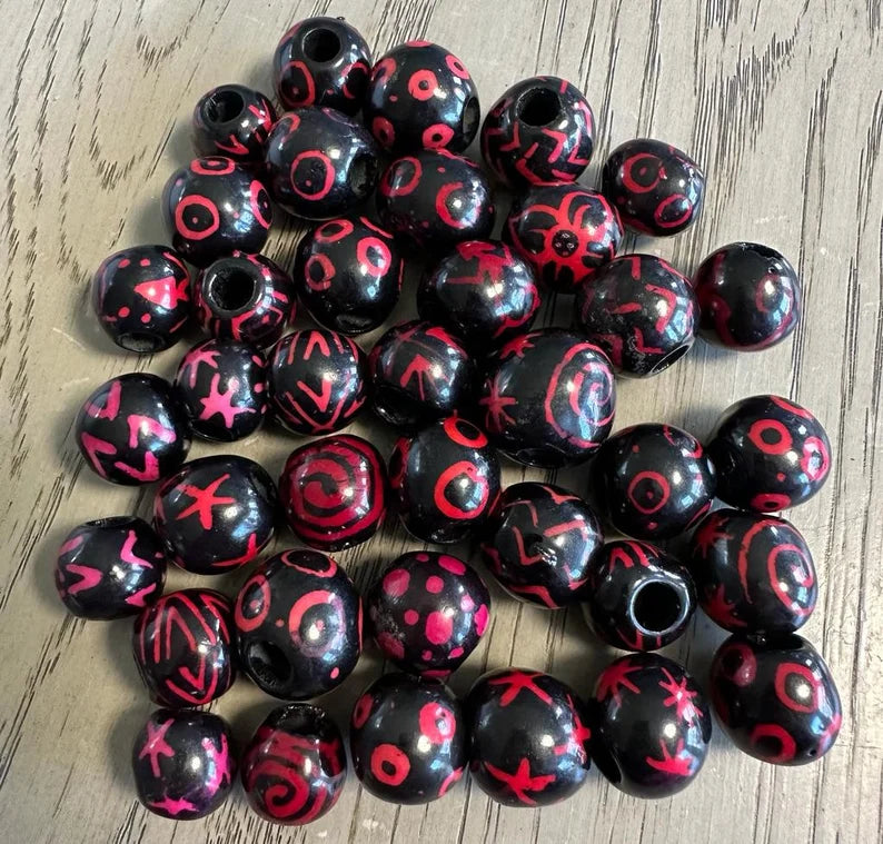 Bombona Ball Beads. 25 Black and Pink Patterned Pieces.