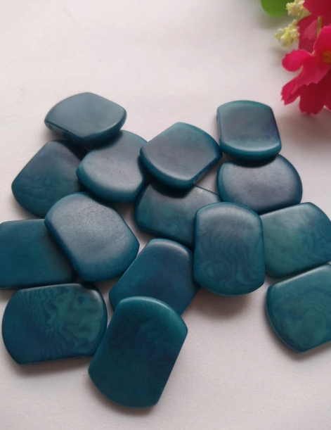 Tagua nut beads. Tagua curved rectangle shape. 15 pieces of tagua in blue. Vertical top drilled 2 holes. 2.5x1.5cm. approx. Ethical Jewelry