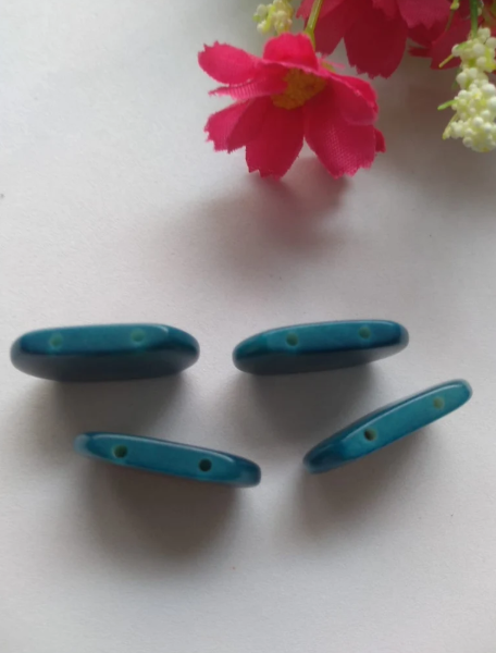 Tagua nut beads. Tagua curved rectangle shape. 15 pieces of tagua in blue. Vertical top drilled 2 holes. 2.5x1.5cm. approx. Ethical Jewelry
