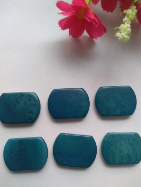 Tagua nut beads. Tagua curved rectangle shape. 15 pieces of tagua in blue. Vertical top drilled 2 holes. 2.5x1.5cm. approx. Ethical Jewelry