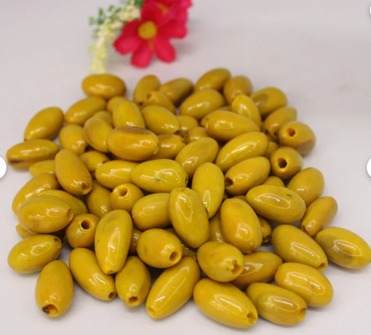 Yellow beads made of camajuro seeds from Colombia. Size: 2.5 x 1.5 cm. approx. Natural beads. Pack of 30 beads. Free Shipping R.1017