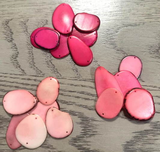 Mix of pink colors. Tagua nut thin slices from Colombia. 4 x 3cm. approx. Vegetable ivory nut. Top and Bottom Drilled. 21 beads in 3 colors
