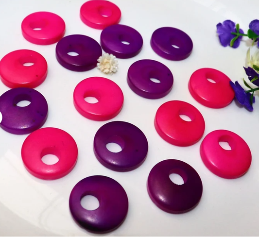 Tagua Beads Donut Shape. Tagua Discs in 2 colors. 16 Tagua Beads. 0.7 in. Height x 0.7 in. Width. Handmade from Colombia. Jewerly Supplies