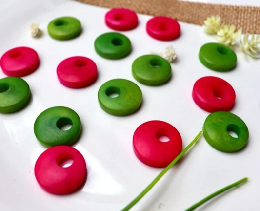 Tagua Beads Donut Shape. Tagua Discs in 2 colors. 16 Tagua Beads. 0.7 in. Height x 0.7 in. Width. Handmade from Colombia. Jewerly Supplies