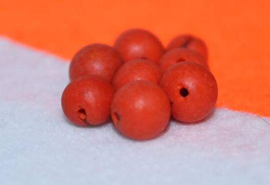 Orange beads Acai seeds from the Colombian Amazonian palm. Size: 1x1cm. Hole size 1mm approx. natural accounts. Pack of 200 beads.