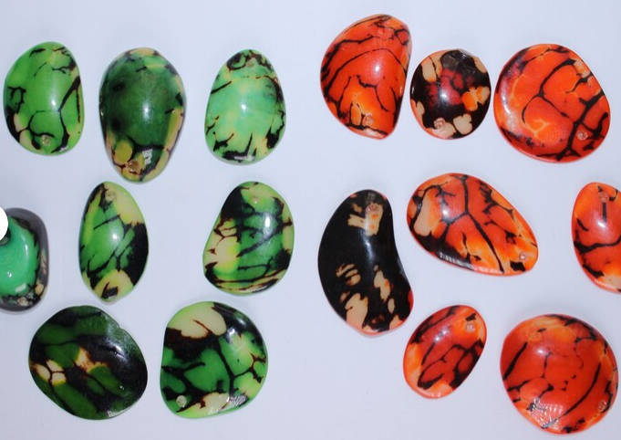 Green and orange Tagua Oval Beads. Natural Seed from Colombia. 44 beads: 18 beads in green and 26 beads in orange. 1,1 x 0,7in Approx.