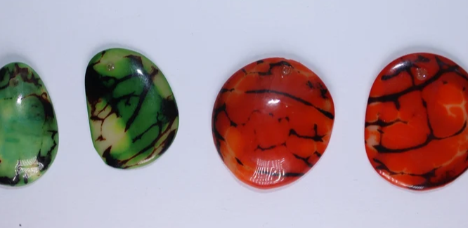 Green and orange Tagua Oval Beads. Natural Seed from Colombia. 44 beads: 18 beads in green and 26 beads in orange. 1,1 x 0,7in Approx.